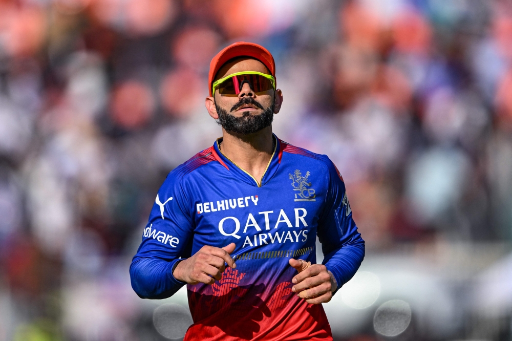 Royal Challengers Bengaluru's Virat Kohli looks on during the Indian Premier League (IPL) Twenty20 cricket match between Gujarat Titans and Royal Challengers Bengaluru at the Narendra Modi Stadium in Ahmedabad on April 28, 2024. (Photo by Punit PARANJPE / AFP)