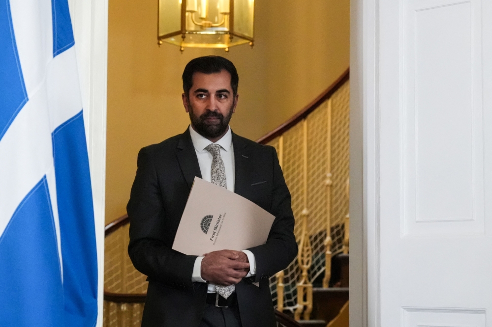 Scotland's First Minister Humza Yousaf arrives to announce his resignation during a statement, at Bute House, in Edinburgh, on April 29, 2024. (Photo by Andrew Milligan / POOL / AFP)
