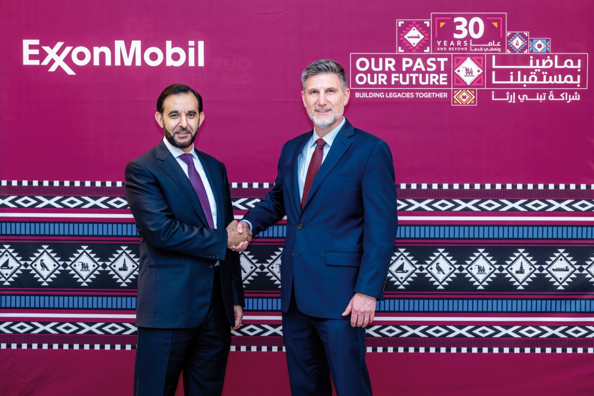 Taher Hamid and Dominic Genetti pose for a photo.