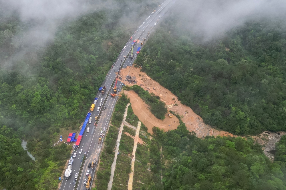 This photo taken on May 1, 2024 shows an aerial view of a collapsed section of a highway near Meizhou, in southern China痴 Guangdong province. (Photo by CNS / CNS / AFP) 