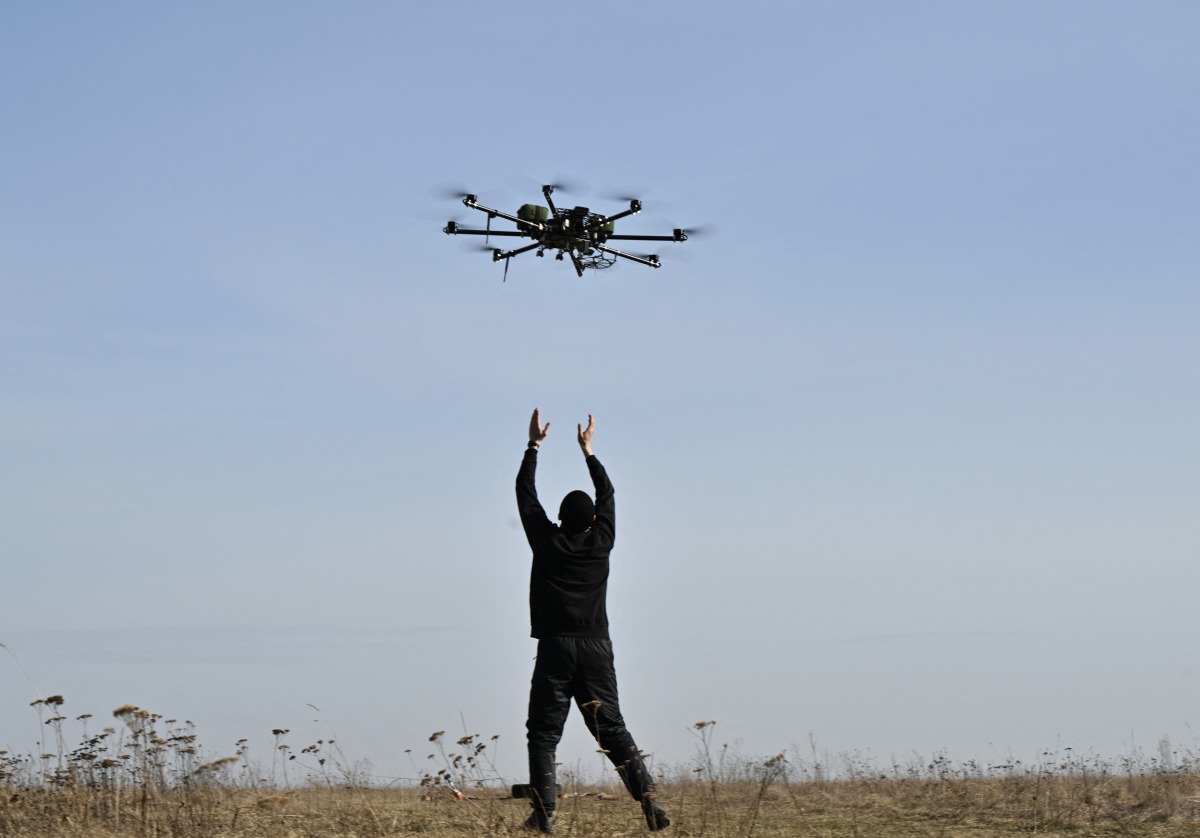 File photo of a pilot practicing with a drone on a training ground in Kyiv region on February 29, 2024. (Photo by Genya SAVILOV / AFP)