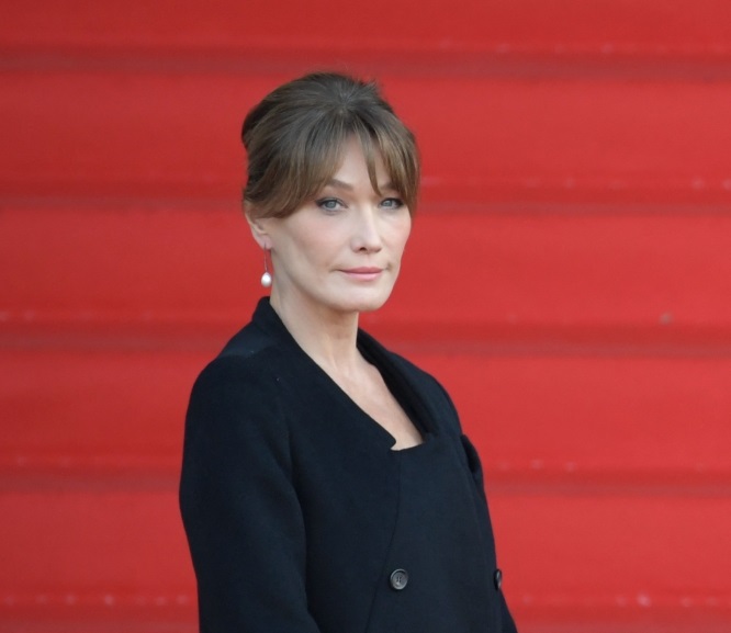 (FILES) French-Italian model and singer Carla Bruni-Sarkozy arrives to attend a church service for former French President Jacques Chirac at the Saint-Sulpice church in Paris on September 30, 2019. Photo by Eric Feferberg / AFP.