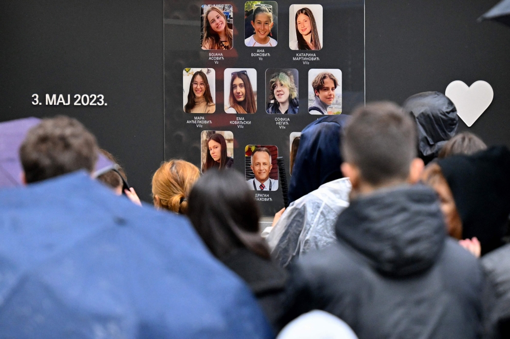 People gather in front of the “Vladislav Ribnikar “ elementary school, to mark the one-year anniversary of a deadly school shooting in the capital Belgrade that led to major protests against the government and pro-gun culture, in Belgrade, Serbia on May 3, 2024. Photo by OLIVER BUNIC / AFP