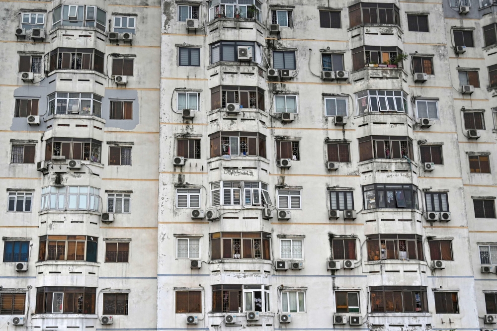 This picture shows air conditioning units outside an apartment building in Hanoi on April 30, 2024. (Photo by Nhac Nguyen / AFP)
 
