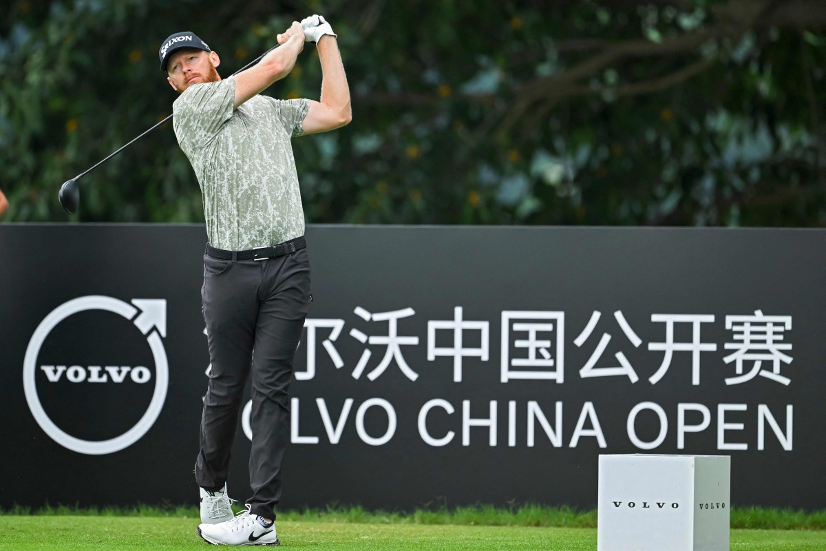 Sweden's Sebastian Sِderberg plays a shot during the second round of China Open Golf tournament in Shenzhen, in southern China's Guangdong province on May 3, 2024. (Photo by AFP)