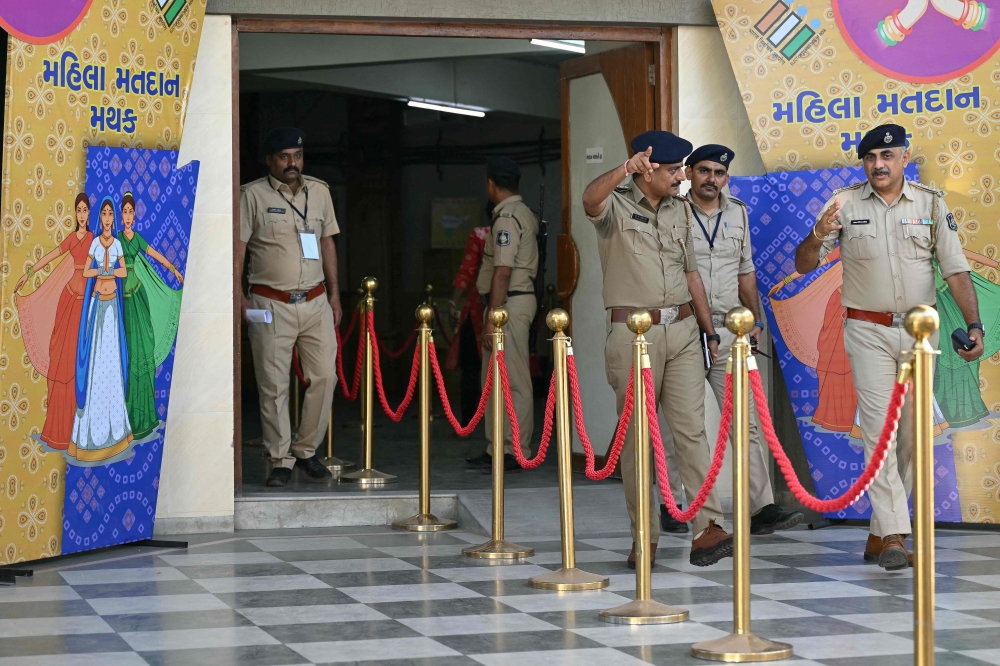 Police inspect the poling centre a day before India痴 prime minister Narendra Modi casts his ballot, at Ranip, Ahmedabad on May 6, 2024. Photo by Sajjad HUSSAIN / AFP.
