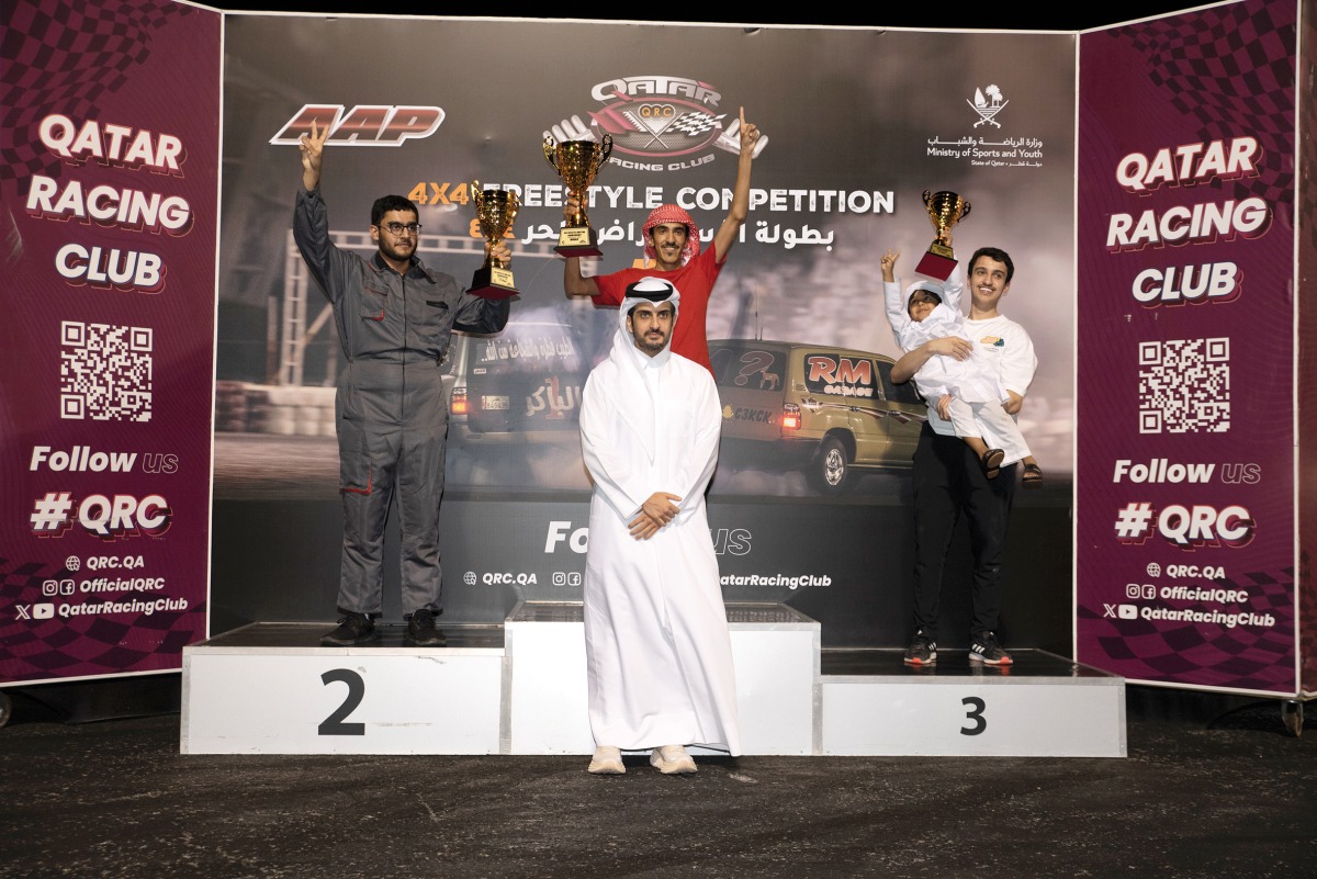 Qatar Racing Club Director Sheikh Jabor bin Khalid Al Thani with the podium winners of the fifth round of Qatar Freestyle Drifting Championship.