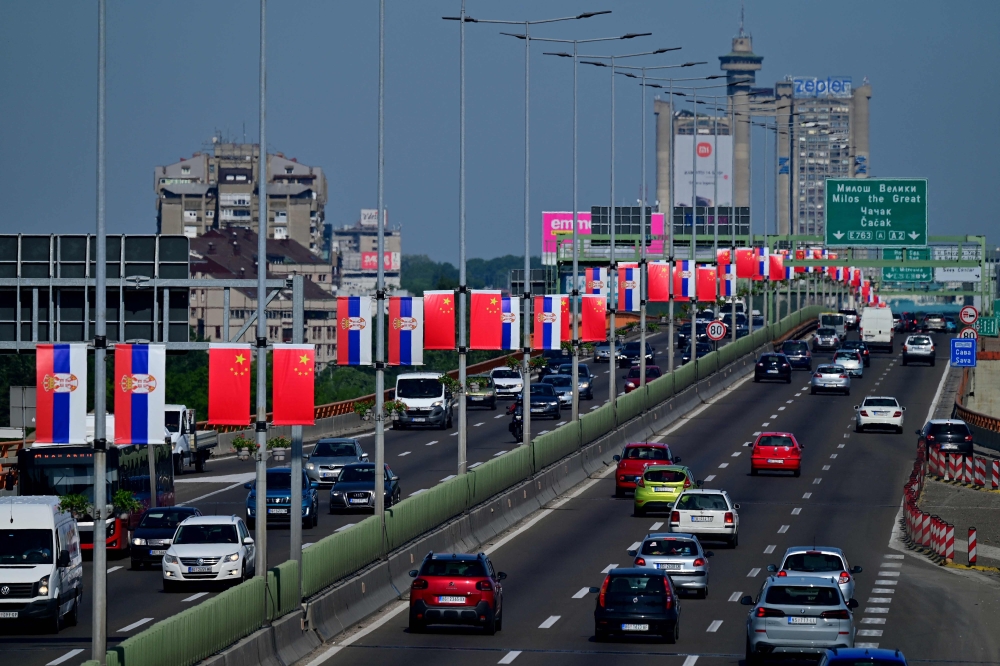 Photo taken on May 6, 2024, shows Chinese and Serbian flags along the high way trough Belgrade on the eve of the visit of Chinese President to Serbia. (Photo by Andrej ISAKOVIC / AFP)
