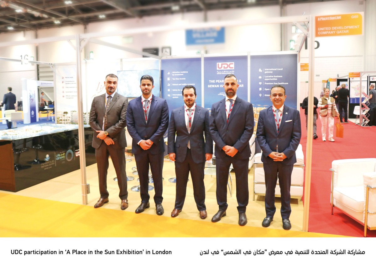 Officials pose for a group photo at the UK’s largest overseas property exhibition. 