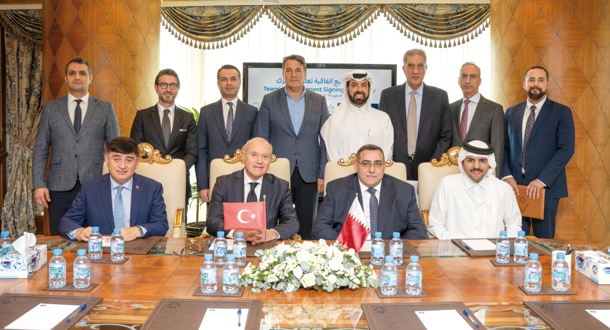 Turkish Ambassador to Qatar H E Dr. Mustafa Goksu , Aamal’s CEO Rashid Al Mansoori with other officials during the signing ceremony.