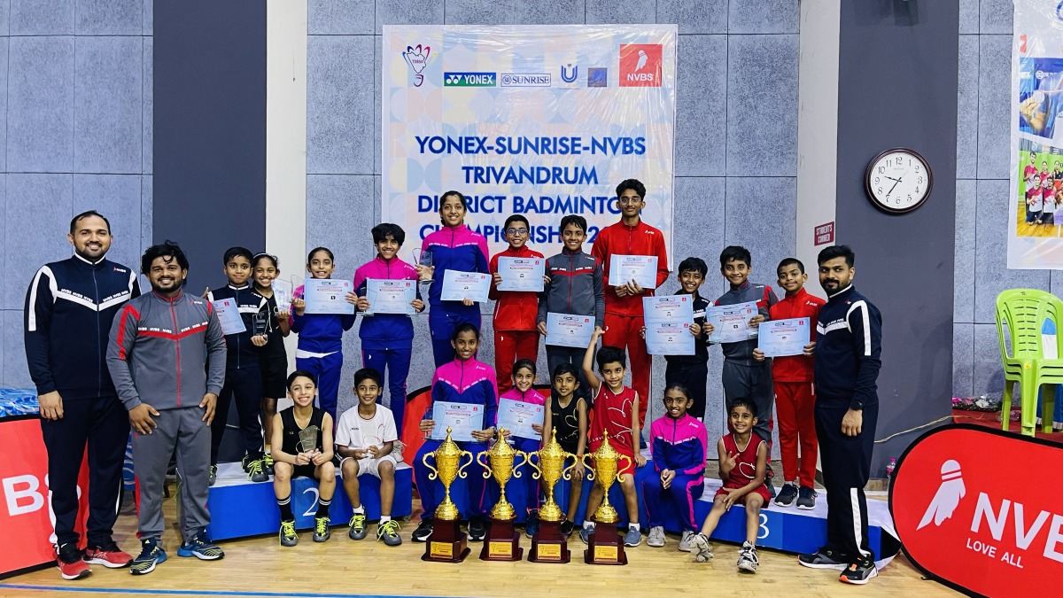 After receiving the prizes, NVBS players posing for the photo with NVBS coaches.