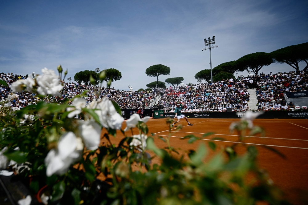 Russia's Andrey Rublev returns to France's Alexandre Muller during the Men's ATP Rome Open tennis tournament at Foro Italico in Rome on May 13, 2024. (Photo by Filippo MONTEFORTE / AFP)