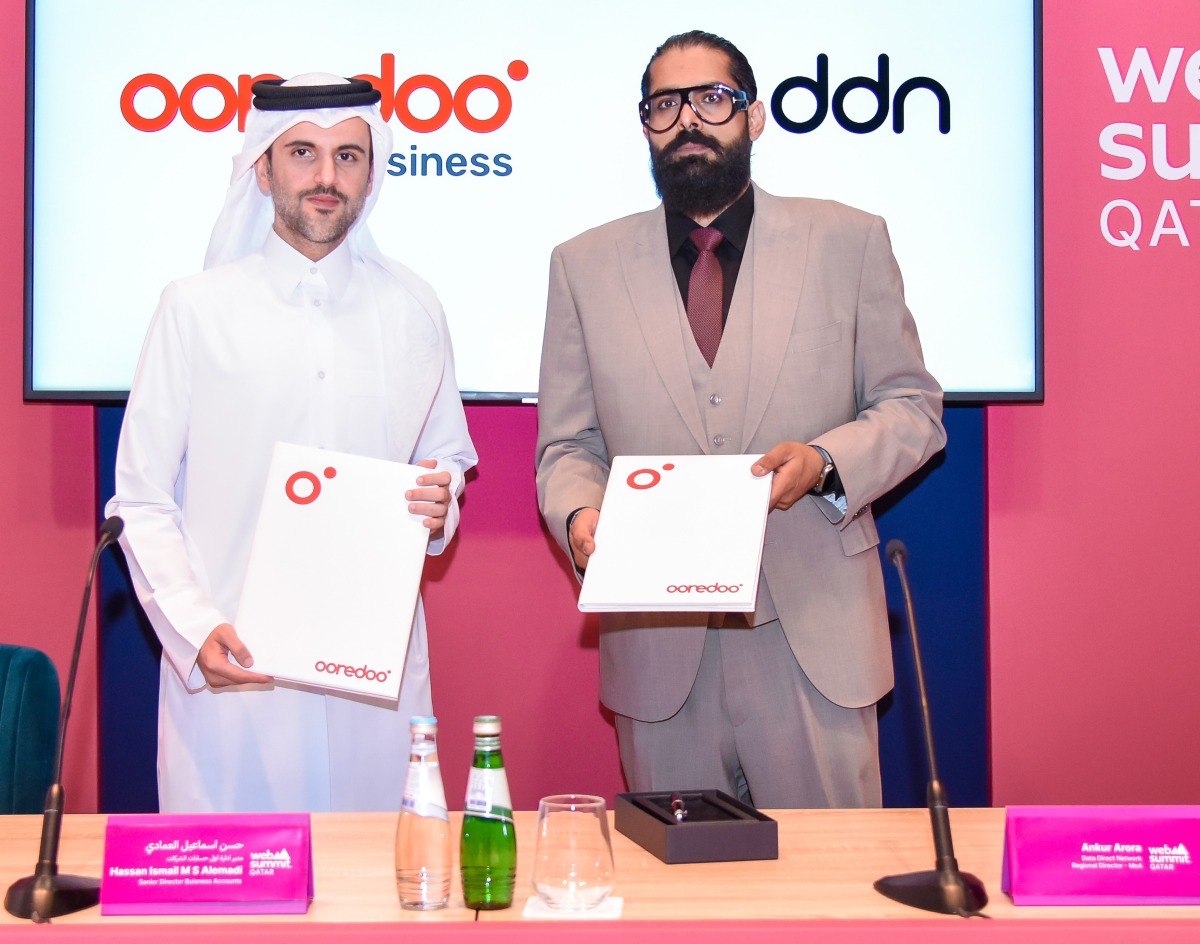 Ooredoo Qatar and DDN officials during the partnership event.