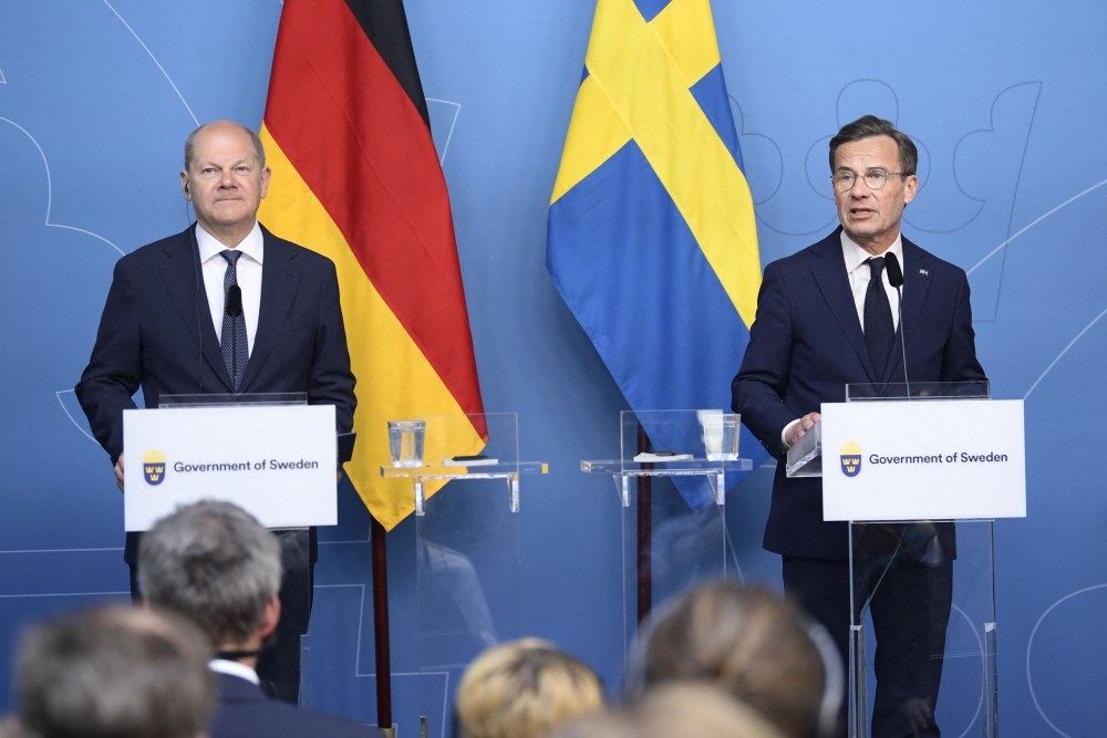 German Chancellor Olaf Scholz (L) and Sweden's Prime Minister Ulf Kristersson hold a news conference at the Norrsken Foundation innovation centre in Stockholm, Sweden, on May 14, 2024. (Photo by Samuel STEEN / TT NEWS AGENCY / AFP)