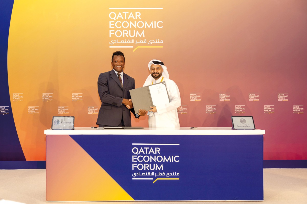 Board Member and Chief Executive Officer of Qatar Financial Centre, Yousuf Mohamed Al Jaida and President of The Hashgraph Association, Kamal Youssefi, during the MoU signing.