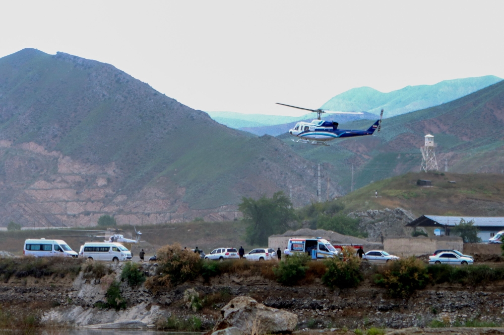 In this photo provided by Islamic Republic News Agency IRNA on May 19, 2024, shows the helicopter carrying Iran's President Ebrahim Raisi taking off at the Iranian border with Azerbaijan after the inauguration of the dam of Qiz Qalasi, in Aras. (Photo by Ali Hamed Haghdoust / IRNA / AFP)