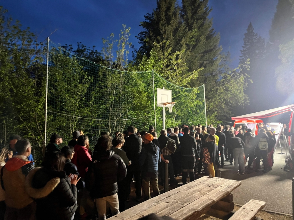 This handout photograph taken and released by the Swiss Police of the Canton of Valais on May 19, 2024 shows about 250 volunteers taking part in a search operation to recover a 6-year-old girl found unconscious in a forest after disappearing in still unknown circumstances while attending a family party. Photo by Handout / POLICE CANTONALE VALAISANNE / AFP.