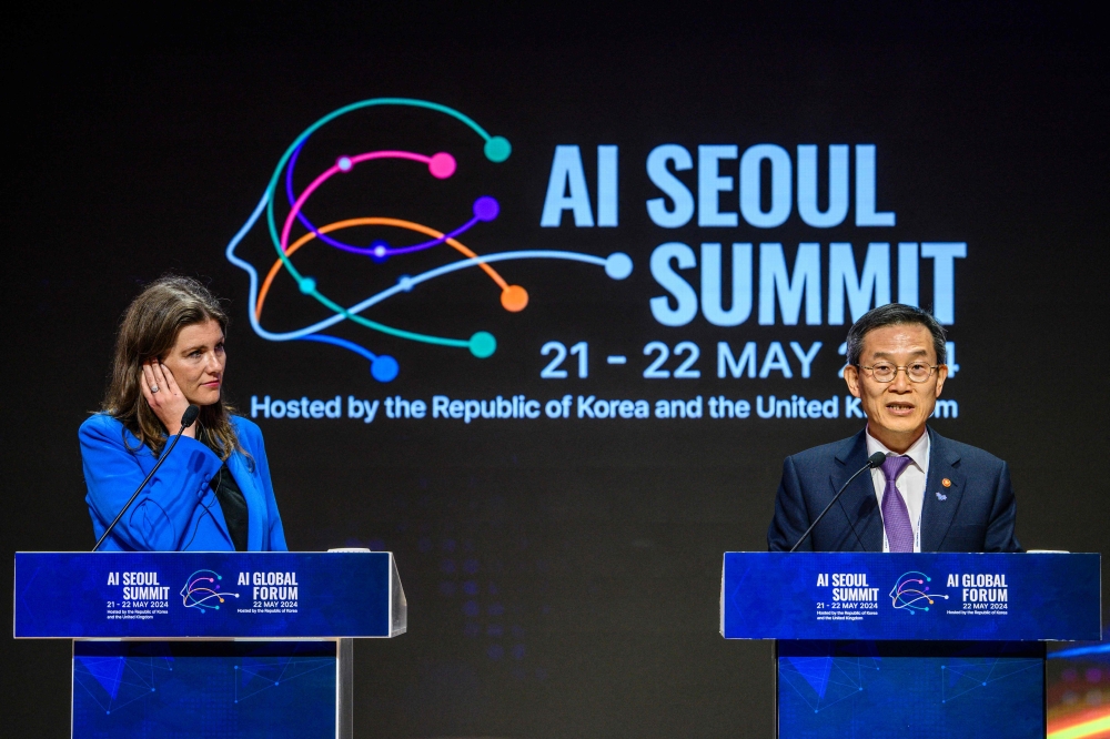 Britain's Secretary of State for Science, Innovation and Technology Michelle Donelan listens as South Korea's Minister of Science and ICT, Lee Jong-ho speaks during a press briefing following the ministers' session of the AI Seoul Summit at the Korea Institute of Science and Technology (KIST) in Seoul on May 22, 2024. Photo by ANTHONY WALLACE / AFP.