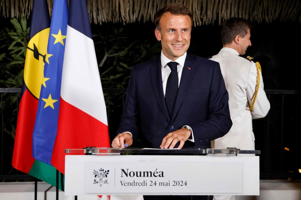 France's President Emmanuel Macron delivers a speech at New Caledonia's High Commissioner residency in Noumea on May 22, 2024, during his trip to the Pacific archipelago in an attempt to resolve a political crisis. Photo by Ludovic MARIN / POOL / AFP.