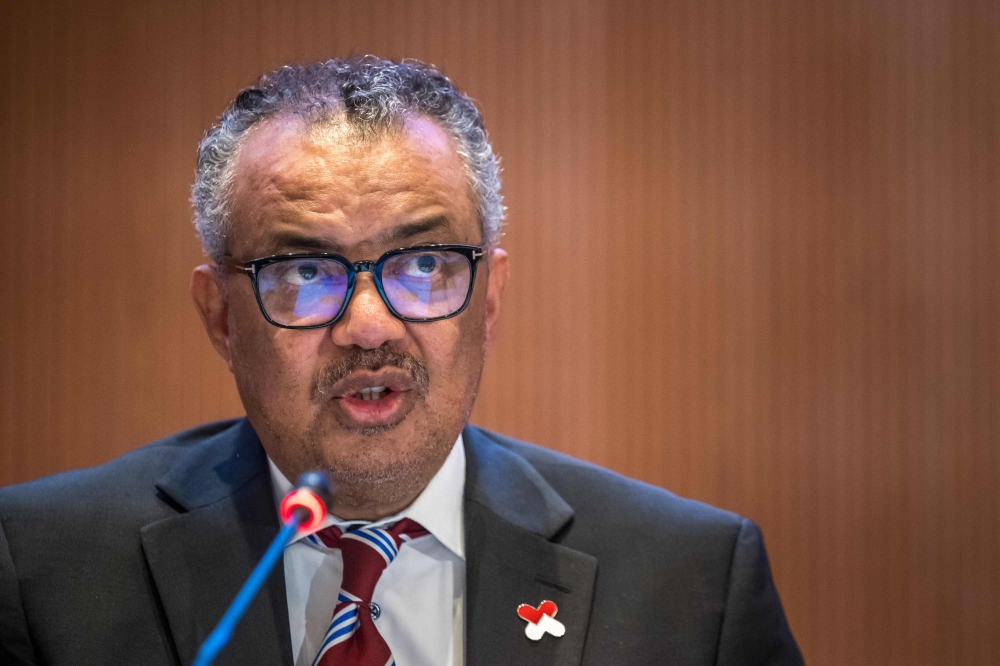 World Health Organization (WHO) Director-General Tedros Adhanom Ghebreyesus (R) delivers his speech on the opening day of the 77th World Health Assembly, in Geneva on May 27, 2024. Photo by Fabrice COFFRINI / AFP