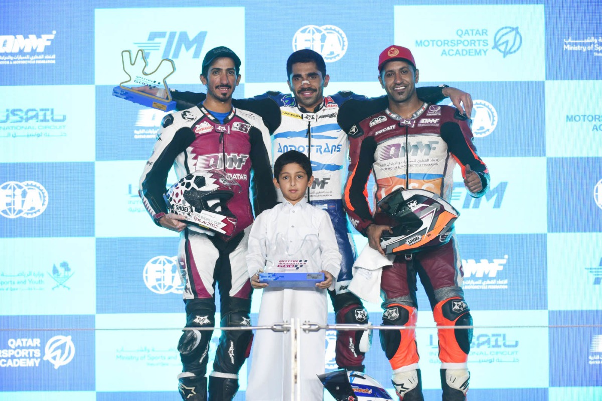 The winner of both QSTK 600 races in Round 3 of the Championship, Abdulla Al Qubaisi (centre) celebrates on the podium with Mashel Al Naimi (left) and Saeed Al Sulaiti who finished second and third respectively. 