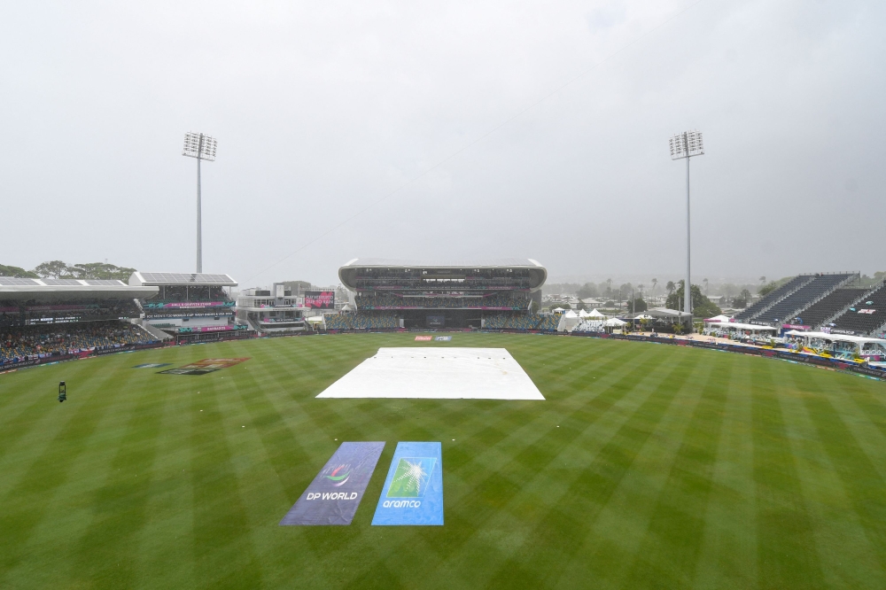 Rain interrupted play during the ICC Men's T20 CWC group B match between England and Scotland at Kensington Oval, Bridgetown, Barbados, on June 4, 2024. (Photo by Randy Brooks / AFP)
