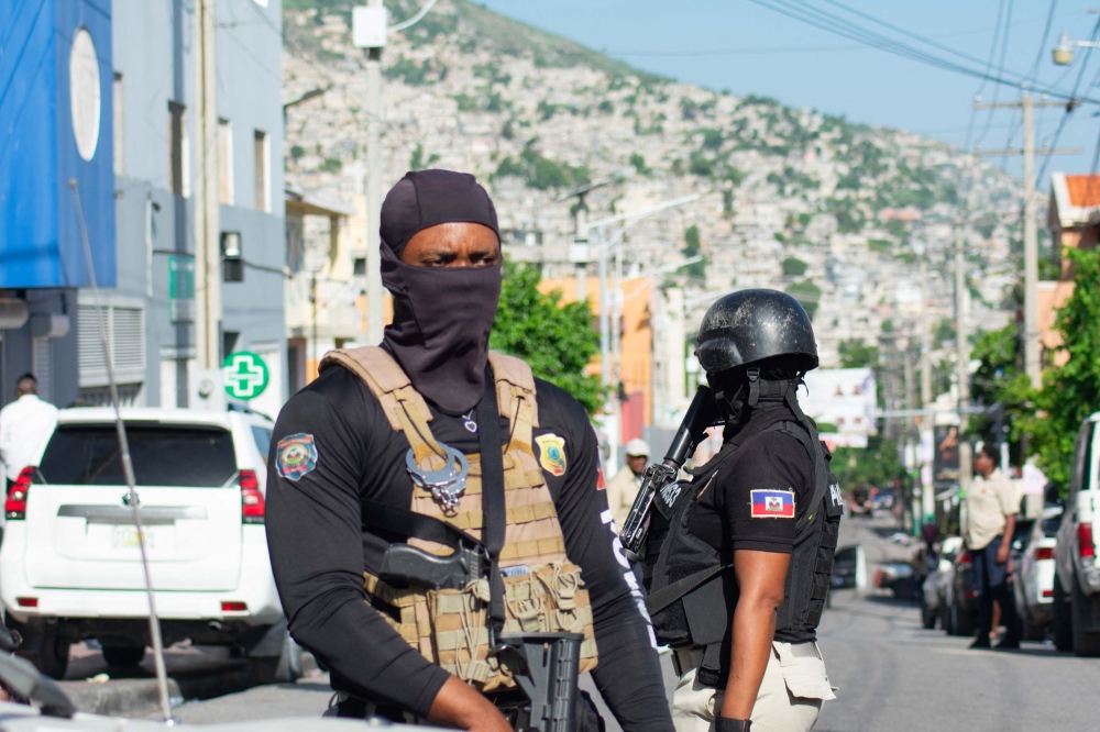 Police provide security outside the hospital where Haiti's new Prime Minister Garry Conille was hospitalised in Port-au-Prince, Haiti, June 9, 2024. (Photo by Clarens Siffroy / AFP)

