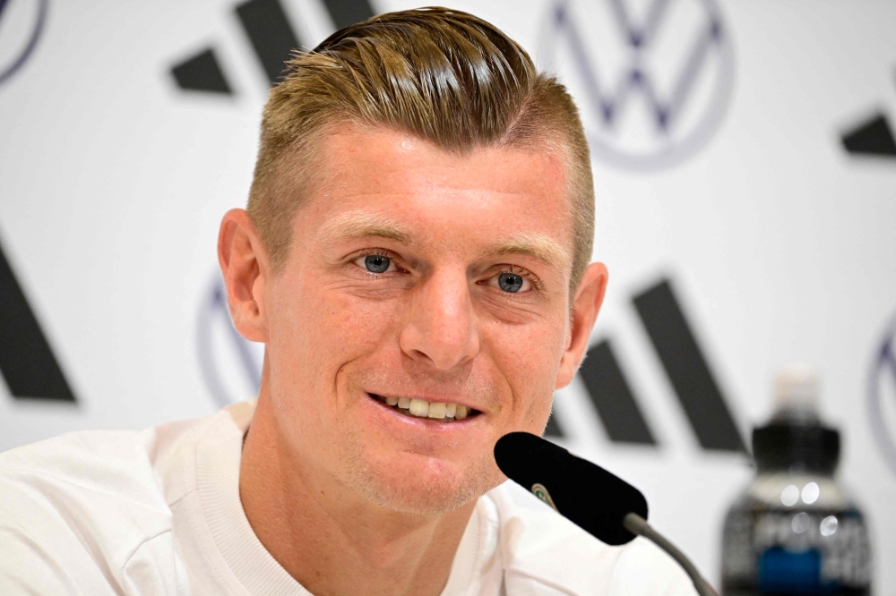 Germany's midfielder #8 Toni Kroos attends a press conference at the team's training camp in Herzogenaurach on June 11, 2024, ahead of the UEFA EURO 2024 football competition. (Photo by Tobias SCHWARZ / AFP)