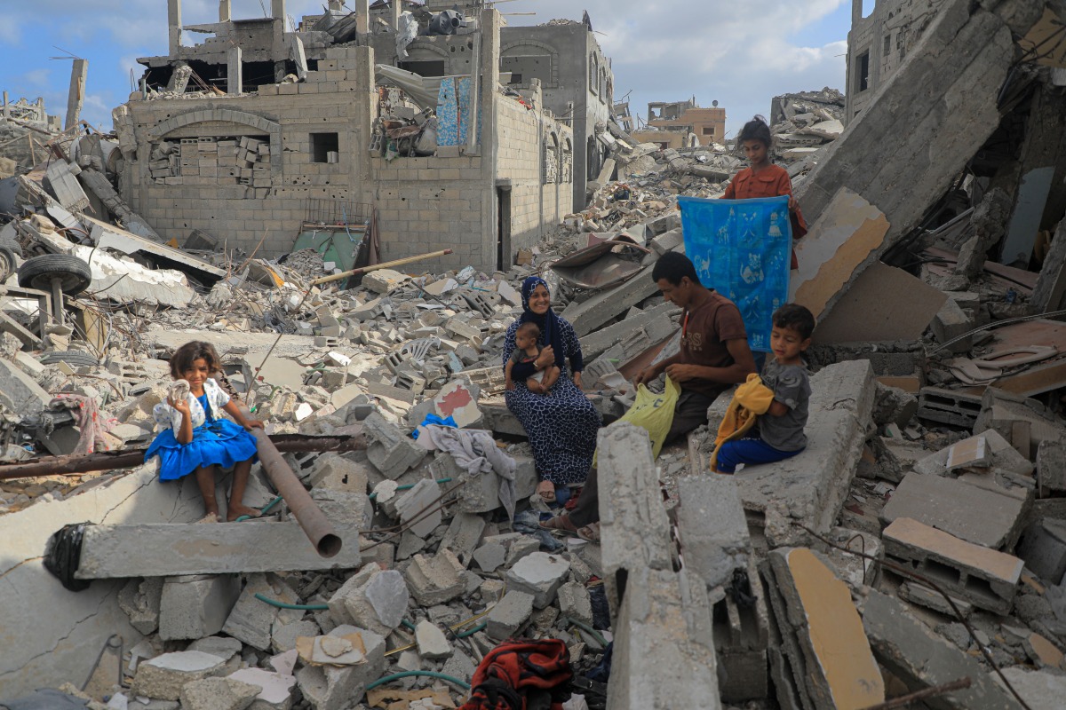 Emad Abu Hamad and his family are pictured in Bani Suhaila town in eastern Khan Younis city in the south of Gaza, on June 17, 2024. (Photo by Rizek Abdeljawad/Xinhua)