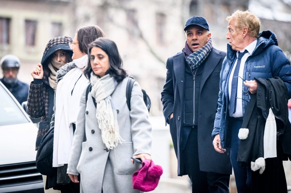 File: Indian-Swiss billionaire family members Namrata Hinduja (left) and Ajay Hinduja (2nd right) arrive at the Genevaa courthouse with their lawyers Yael Hayat (centre) and Robert Assael (right) at the opening day of their trial for human trafficking on January 15, 2024. (Photo by Gabriel Monnet / AFP)