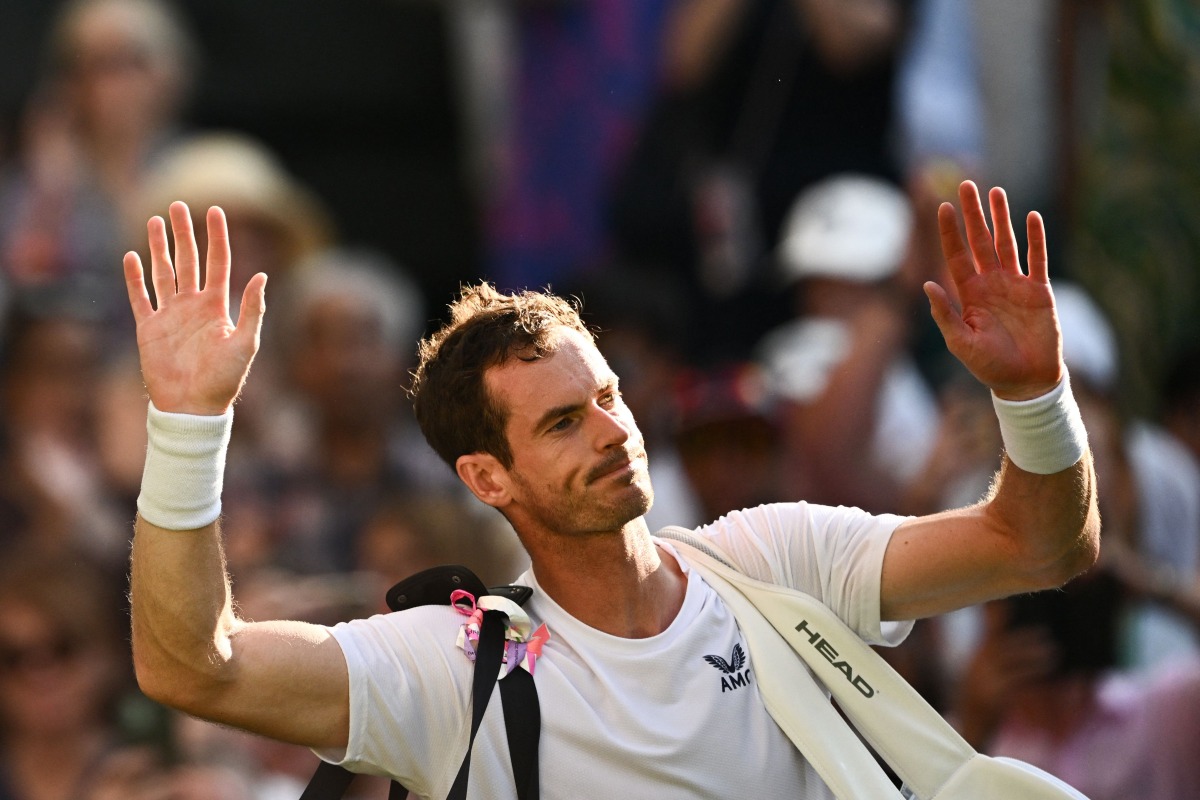 Files: Britain's Andy Murray waves to the public as he leaves Centre Court following his defeat against Greece's Stefanos Tsitsipas during their men's singles tennis match on the fifth day of the 2023 Wimbledon Championships at The All England Tennis Club in Wimbledon, southwest London, on July 7, 2023.(Photo by SEBASTIEN BOZON / AFP)