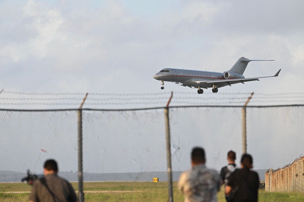 The plane carrying WikiLeaks founder Julian Assange lands at Saipan International Airport after a stopover in Bangkok in Saipan, Northern Mariana Islands, on June 26, 2024, after reaching a plea deal with US authorities. (Photo by Yuichi Yamazaki / AFP)