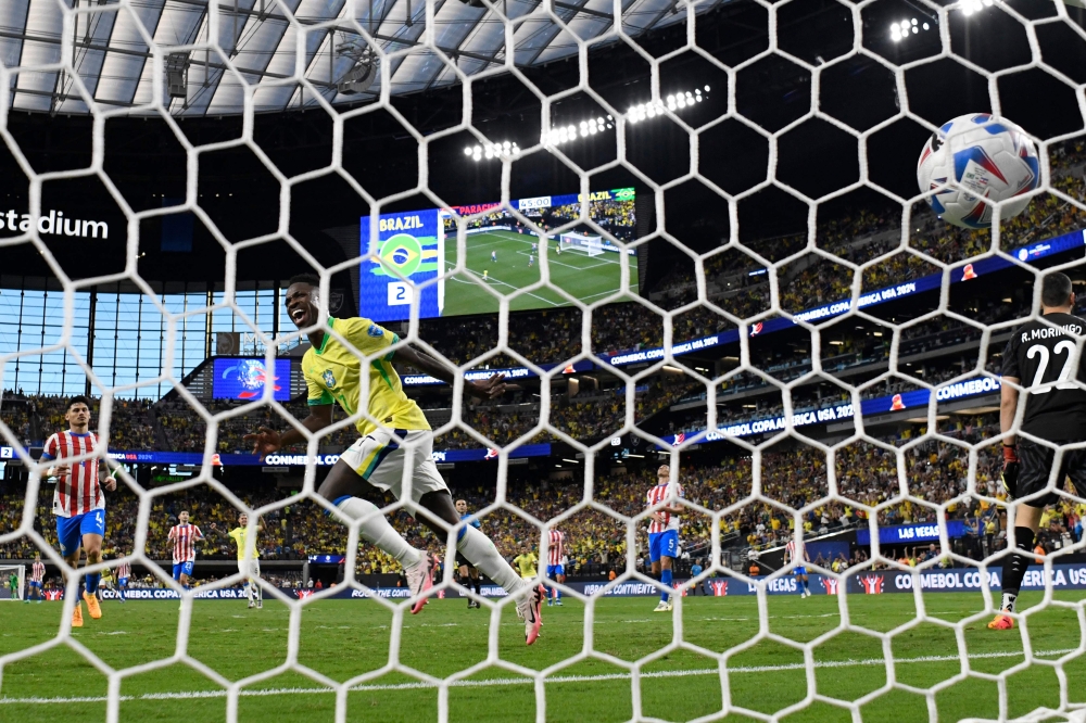 Vinicius Junior of Brazil celebrates after scoring the team's third goal during the CONMEBOL Copa America 2024 Group D match between Paraguay and Brazil at Allegiant Stadium on June 28, 2024 in Las Vegas, Nevada. Kevork Djansezian/Getty Images/AFP