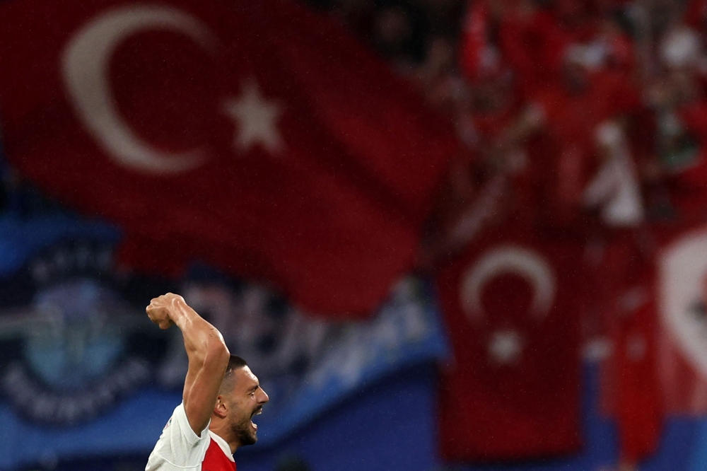 Turkiye's defender #03 Merih Demiral celebrates after scoring his team's second goal during the UEFA Euro 2024 round of 16 football match between Austria and Turkiye at the Leipzig Stadium in Leipzig on July 2, 2024. (Photo by Adrian DENNIS / AFP)