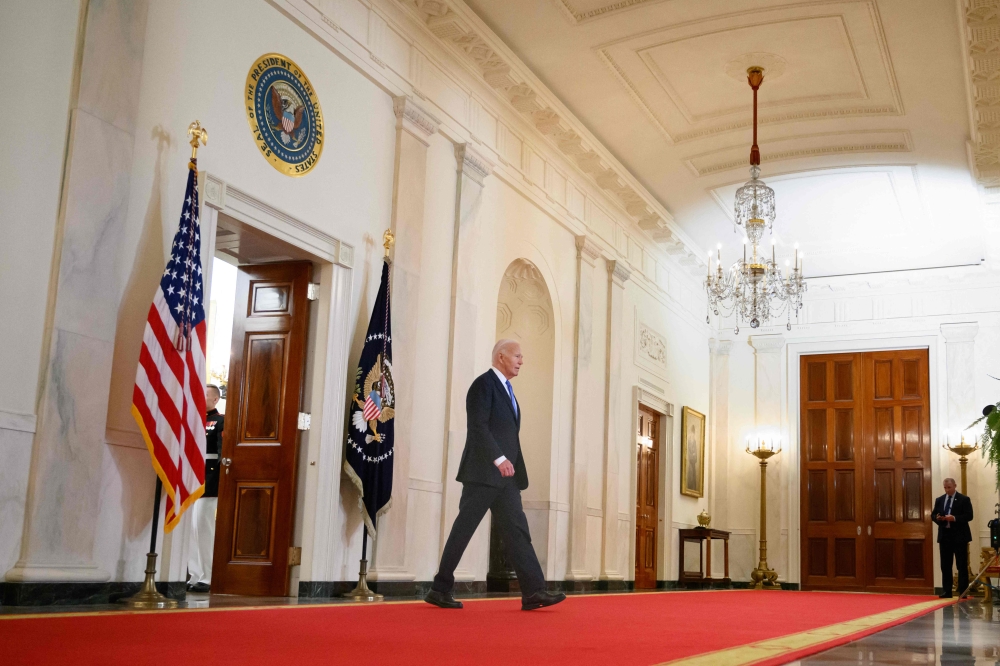 US President Joe Biden walks to deliver remarks on the Supreme Court's immunity ruling at the Cross Hall of the White House in Washington, DC on July 1, 2024. (Photo by Mandel Ngan / AFP)
 