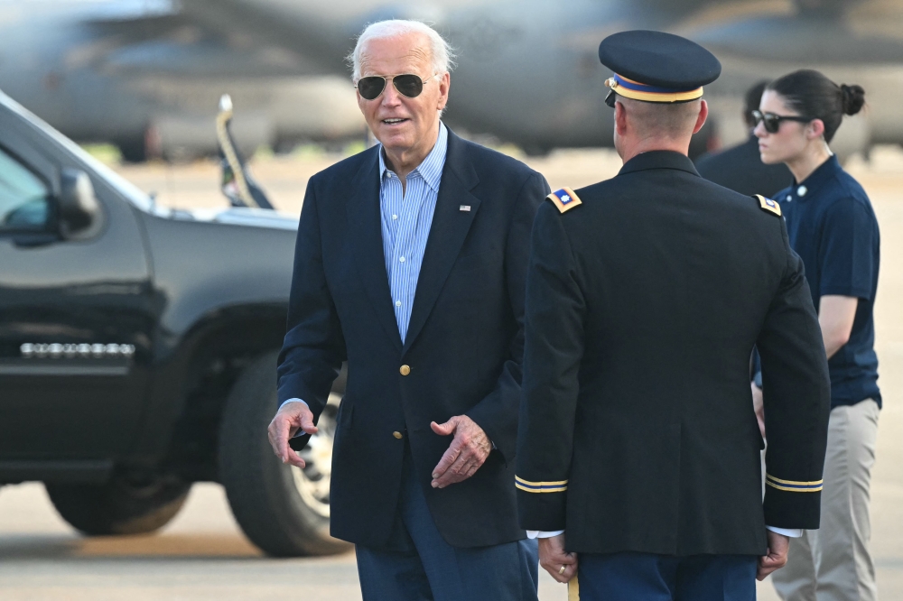 US President Joe Biden disembarks from Air Force One upon arrival at Delaware Air National Guard Base in New Castle, Delaware, July 5, 2024. (Photo by Saul Loeb / AFP)