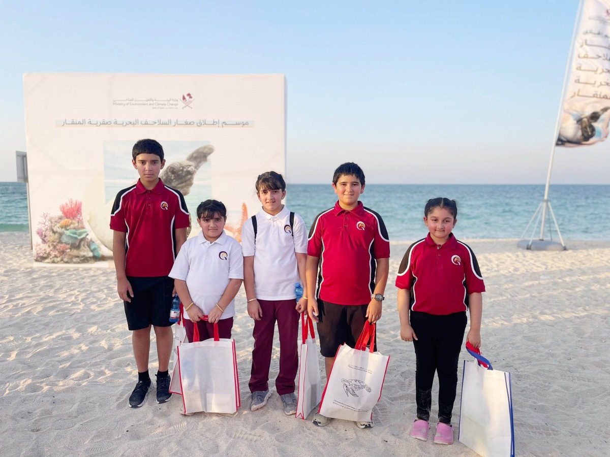Students take part in the initiative to release baby hawksbill turtles. 
