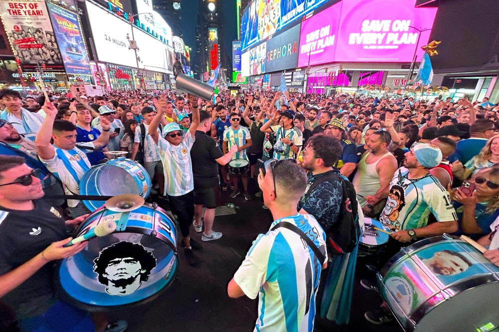 Argentina's supporters cheer as they gather at Times Square, New York City, on July 8, 2024. (Photo by Juan Mabromata / AFP)