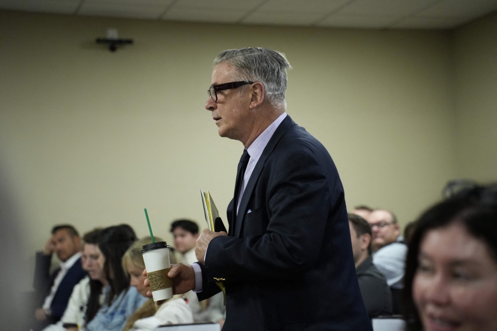 US actor Alec Baldwin arrives in the courtroom for his trial on involuntary manslaughter at Santa Fe County District Court in Santa Fe, New Mexico, on July 12, 2024. (Photo by RAMSAY DE GIVE / POOL / AFP)
