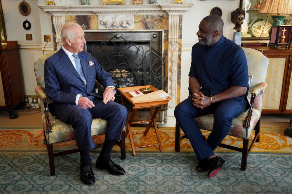 Britain's King Charles III (L) meets British actor Idris Elba during an event for The King's Trust to discuss youth opportunities, at St James's Palace in central London on July 12, 2024. (Photo by Yui Mok / POOL / AFP)
