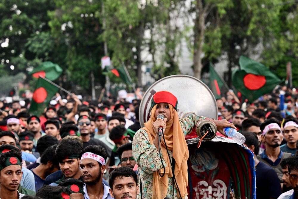 Student activists shout slogans before they submit their memorandum to the country's President on quota reforms on July 14, 2024. (Photo by Munir Uz Zaman / AFP)