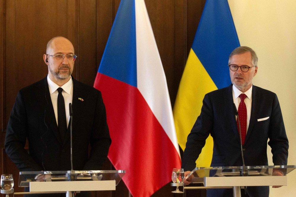 Ukrainian Prime Minister Denys Shmyhal (L) and Czech Prime Minister Petr Fiala deliver a joint press conference following a meeting of the Czech and Ukrainian governments in Prague, Czech Republic on July 16, 2024. (Photo by MILAN KAMMERMAYER / AFP)
