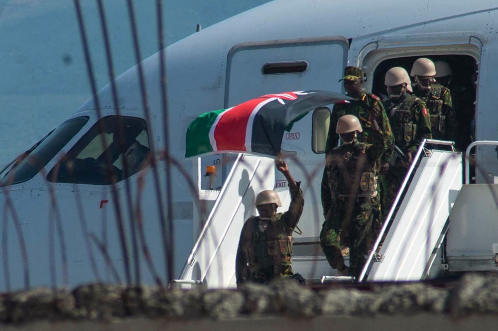 File: Kenyan security forces arrive at Toussaint Louverture International Airport in Port-au-Prince on June 25, 2024. (Photo by Clarens Siffroy / AFP)