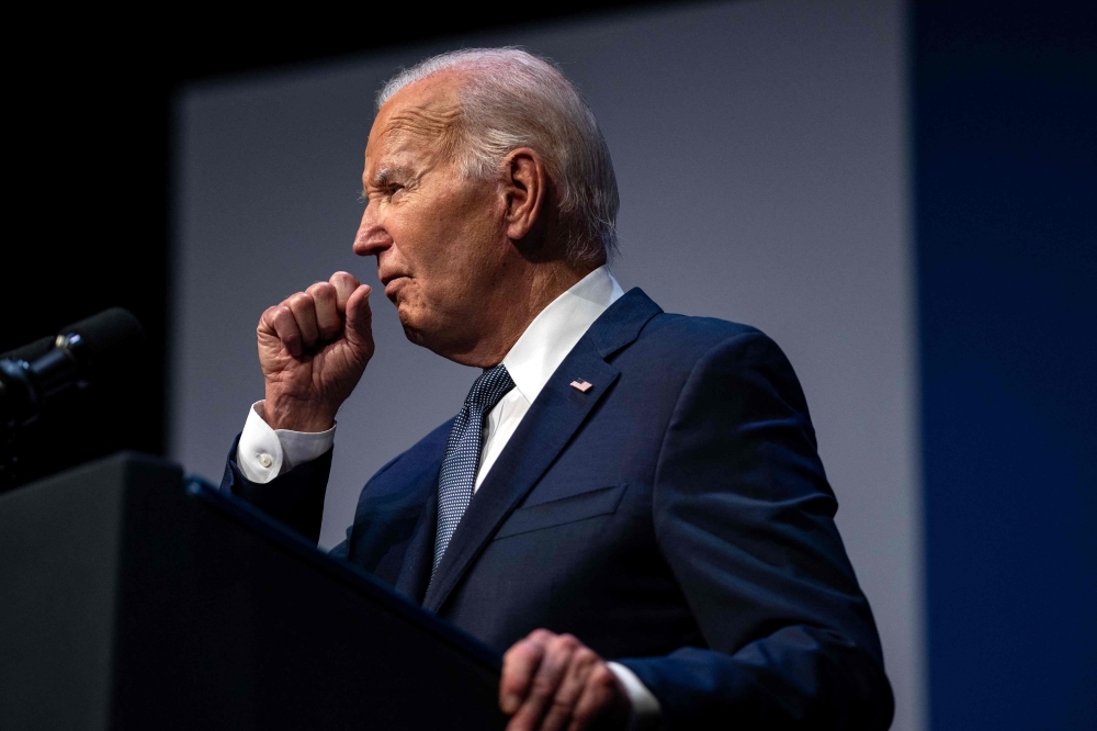 This photo taken on July 16, 2024 shows US President Joe Biden clearing his throat as he speaks on economics during the Vote To Live Properity Summit at the College of Southern Nevada in Las Vegas, Nevada. (Photo by Kent Nishimura / AFP)