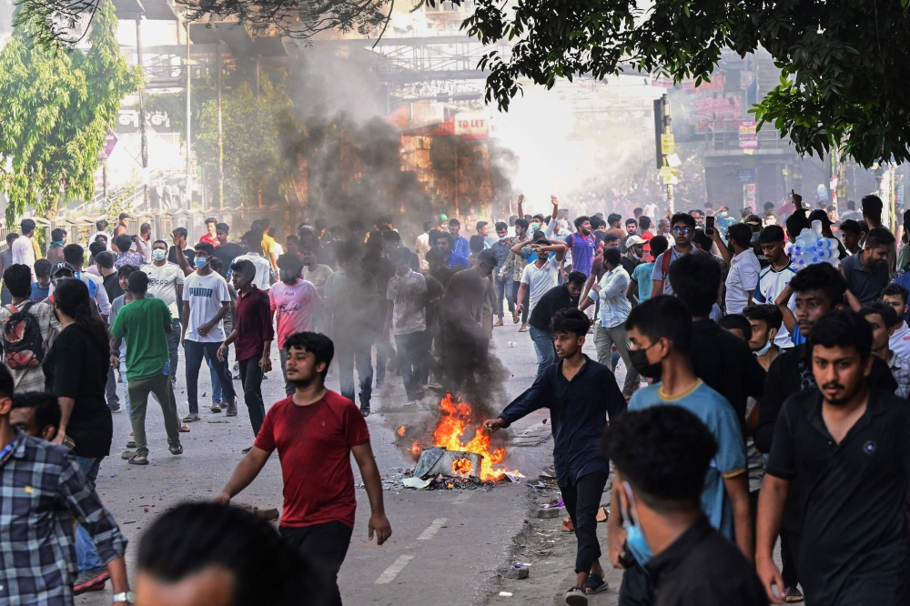Students take part in the ongoing anti-quota protest in Dhaka on July 18, 2024. (Photo by Munir UZ ZAMAN / AFP)
