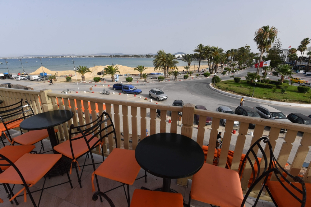 A general view of a beach as sand is spread to protect against rising sea levels and erosion, in the tourist town of Hammamet, about 65 kilometres southeast of Tunisia's capital on June 28, 2024. (Photo by Fethi Belaid / AFP)