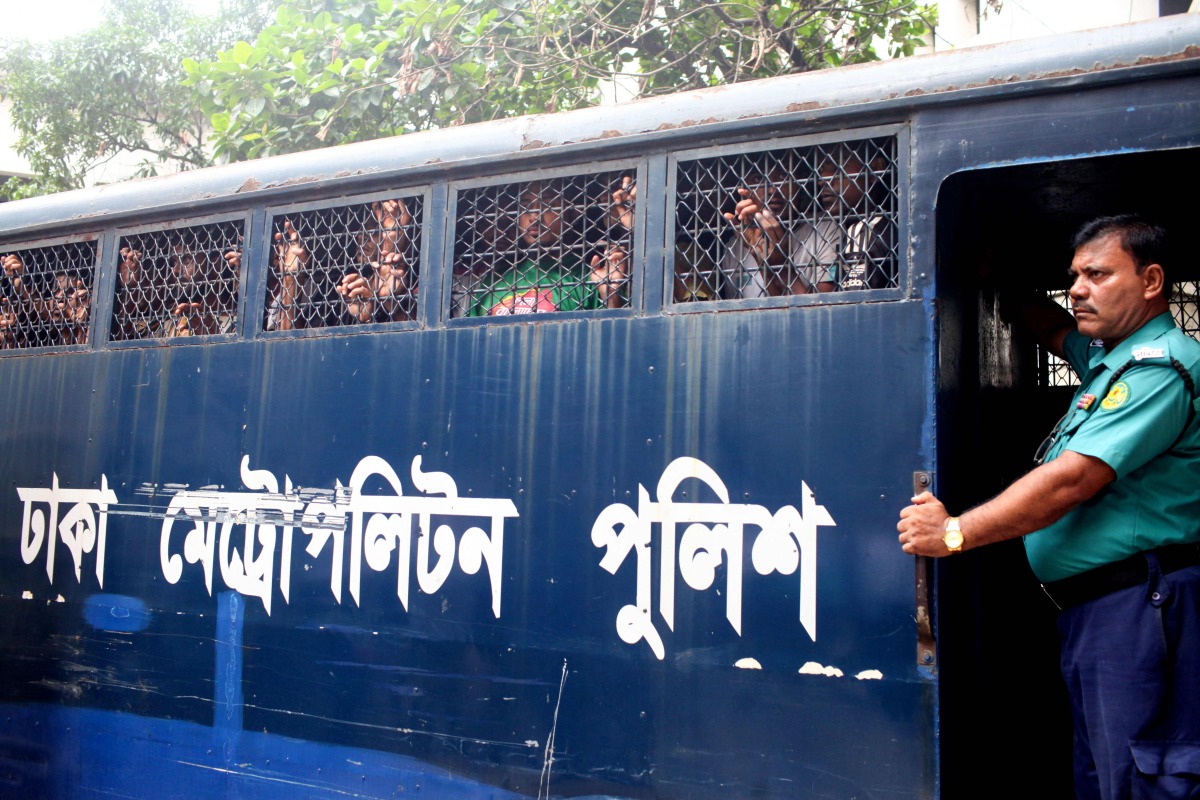 A police van transports protesters to the court, after their arrest in Dhaka on July 23, 2024. The number of arrests in days of violence in Bangladesh passed the 2,500 mark in an AFP tally on July 23, after protests over employment quotas sparked widespread unrest. (Photo by Abu SUFIAN JEWEL / AFP)