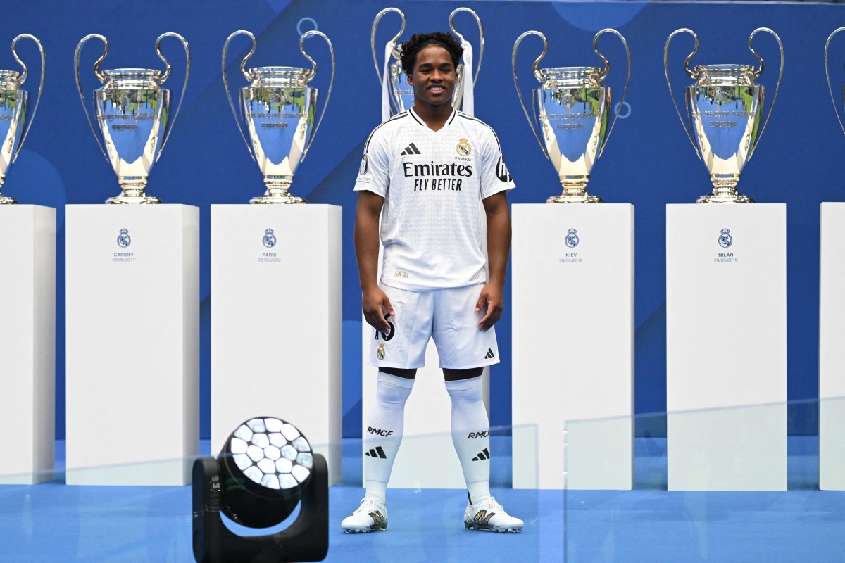 Brazilian forward Endrick Felipe poses during his first appearance as a new Real Madrid player at The Santiago Bernabeu Stadium in Madrid on July 27, 2024. (Photo by JAVIER SORIANO / AFP)
