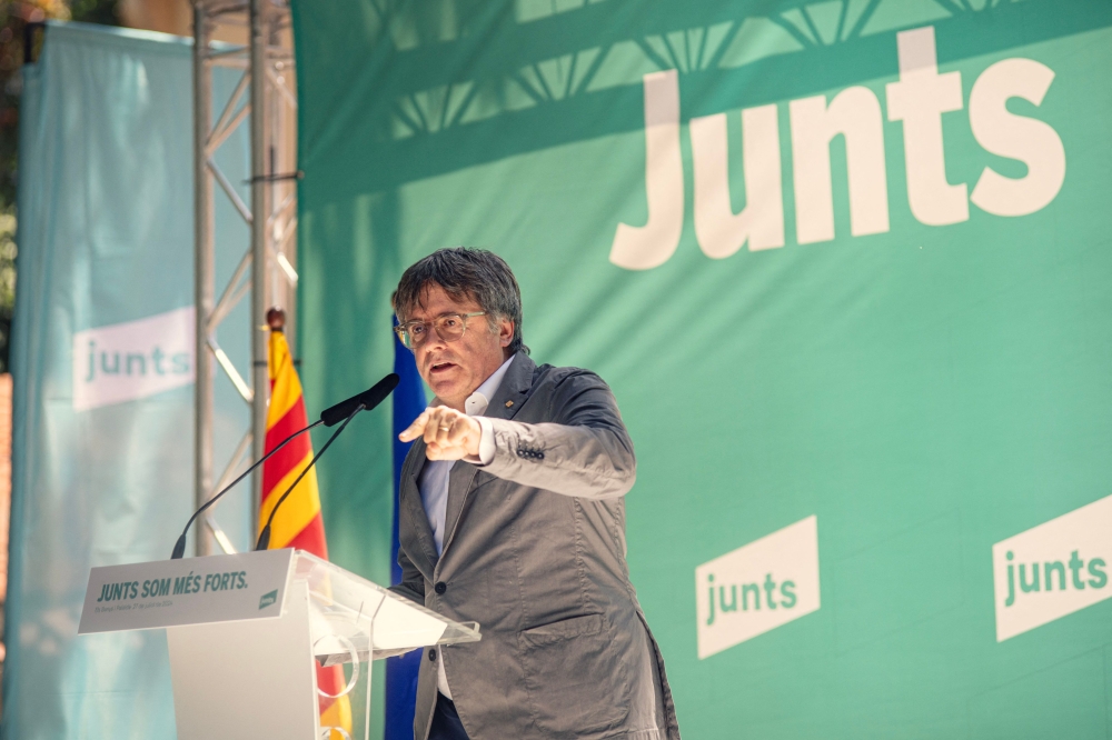 Exiled Catalan separatist leader, Spanish member of the European Parliament and founder of the Junts per Catalunya (Together for Catalonia) party Carles Puigdemont delivers a speech at Amelie-les-Bains, south-western France on July 27, 2024, during a meeting held to celebrate the fourth anniversary of the foundation of the party. (Photo by IDRISS BIGOU-GILLES / AFP)
