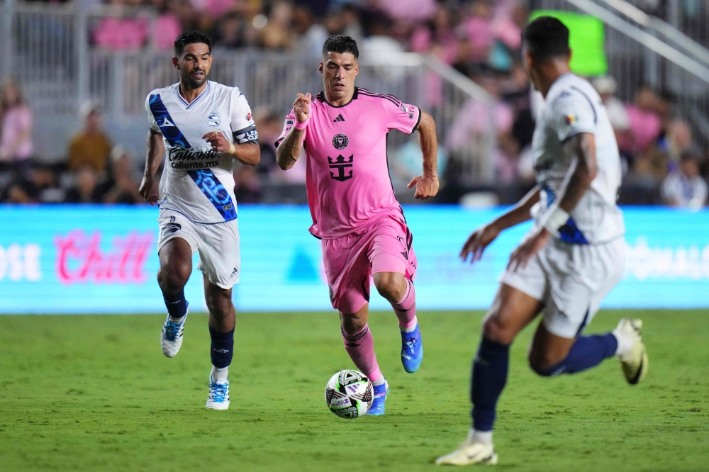 Luis Suarez #9 of Inter Miami CF dribbles the ball in the second half on July 27, 2024 in Fort Lauderdale, Florida. Rich Storry/Getty Images/AFP 